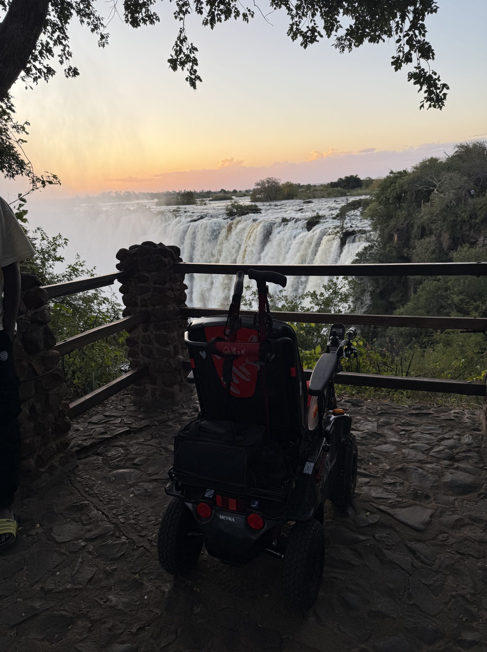 Power-chair in front of the Victoria Falls